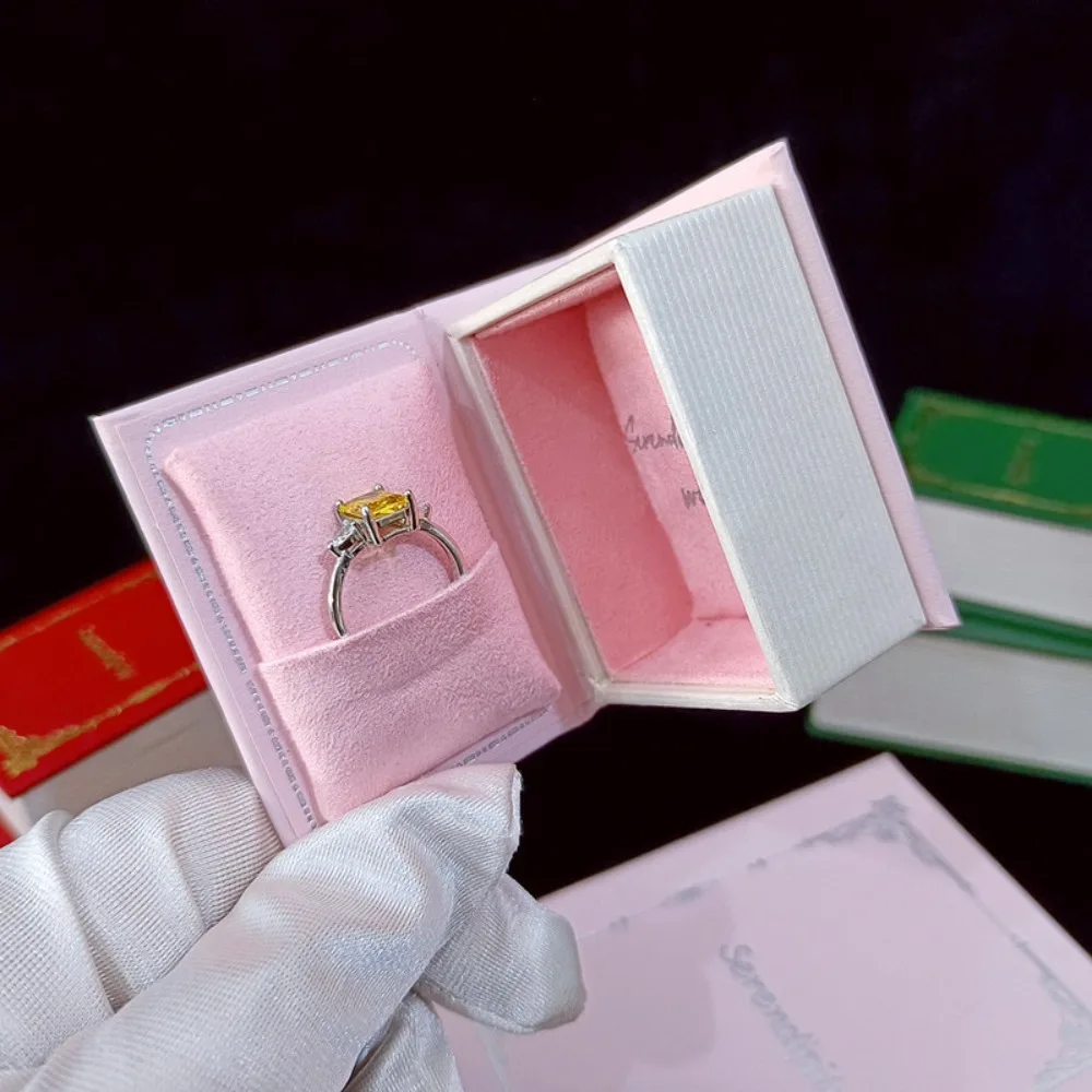 

Новинка, шкатулка для драгоценностей в форме книги, откидная крышка, ожерелья, коробка для хранения ювелирных изделий, сумка, магнитная застежка, кольца, органайзер для сережек