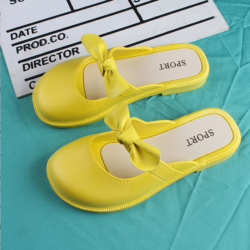 Children\'s New Summer PVC Little Girl Fashion Outside Wearing Solid Color Bow Half Drag Flat Sandals