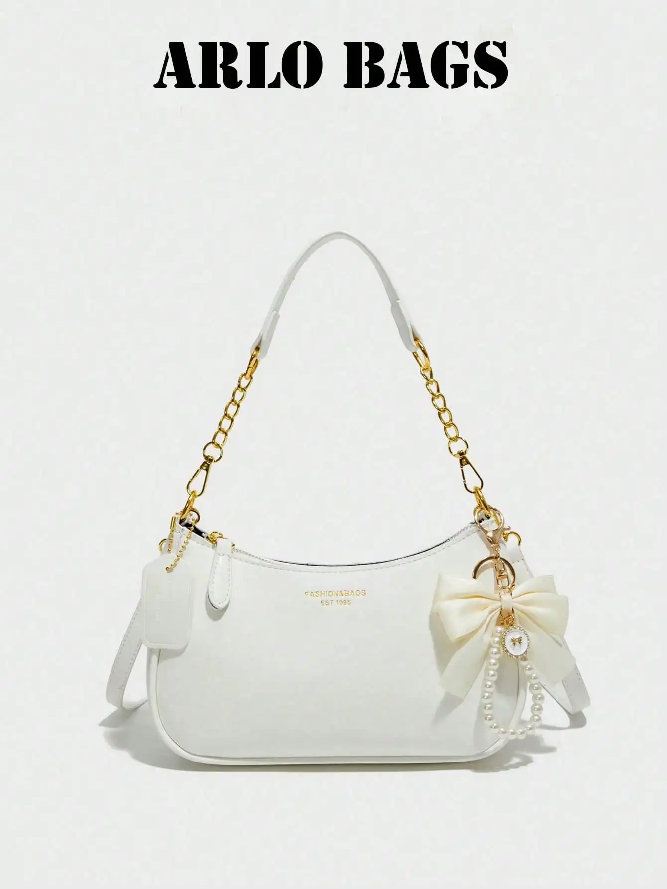 

This Women's Shoulder Bag Is Made Of Solid Color PU Material, Decorated With Letters, Bows, And Pearl Pendants, Exuding A Fashionable Vibe. The Bag Features A Zipper And Metal Chain Design, Making It Stylish And Multi-Purpose, Easy To Wear As A Crossbody