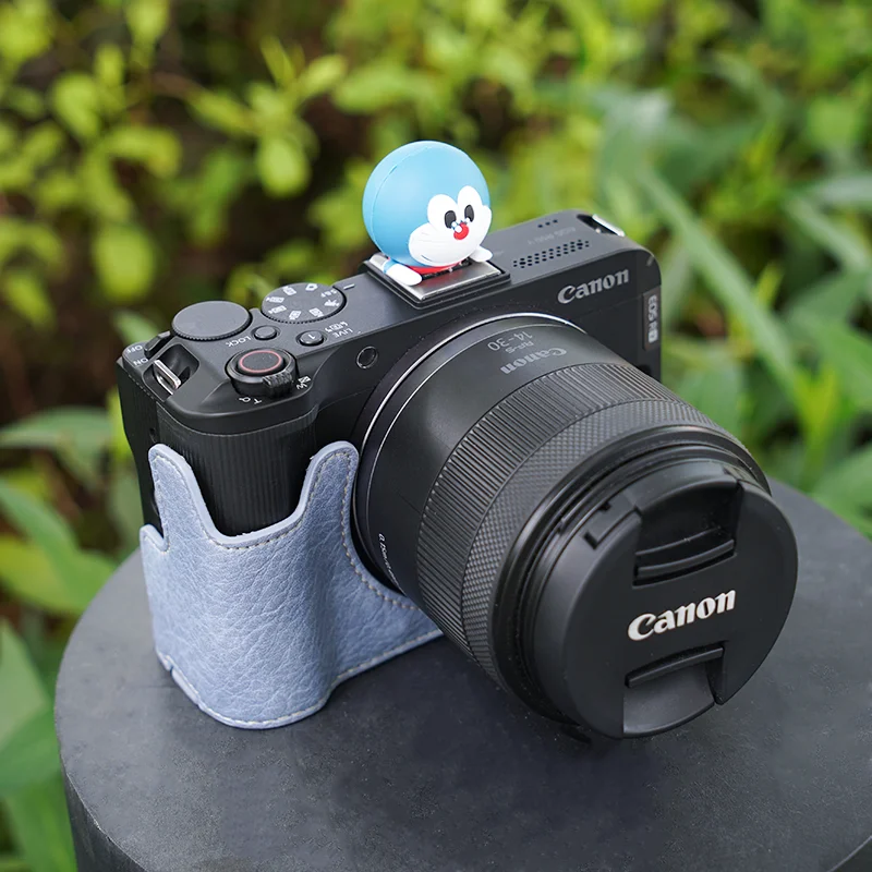 حافظة كاميرا بنمط ليتشي R50V جديدة مع حزام كتف لكاميرا Canon R50v وقاعدة حماية نصف قاعدة