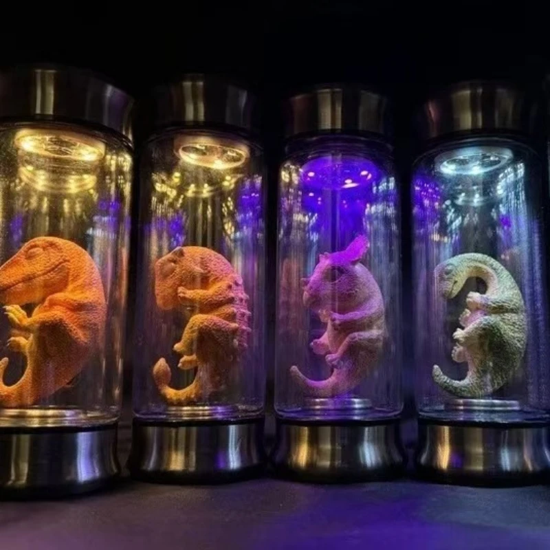 Parque Jurásico de dinosaurio, tarro con brillo, Mundo Jurásico, Velociraptor azul, réplica de utilería de película