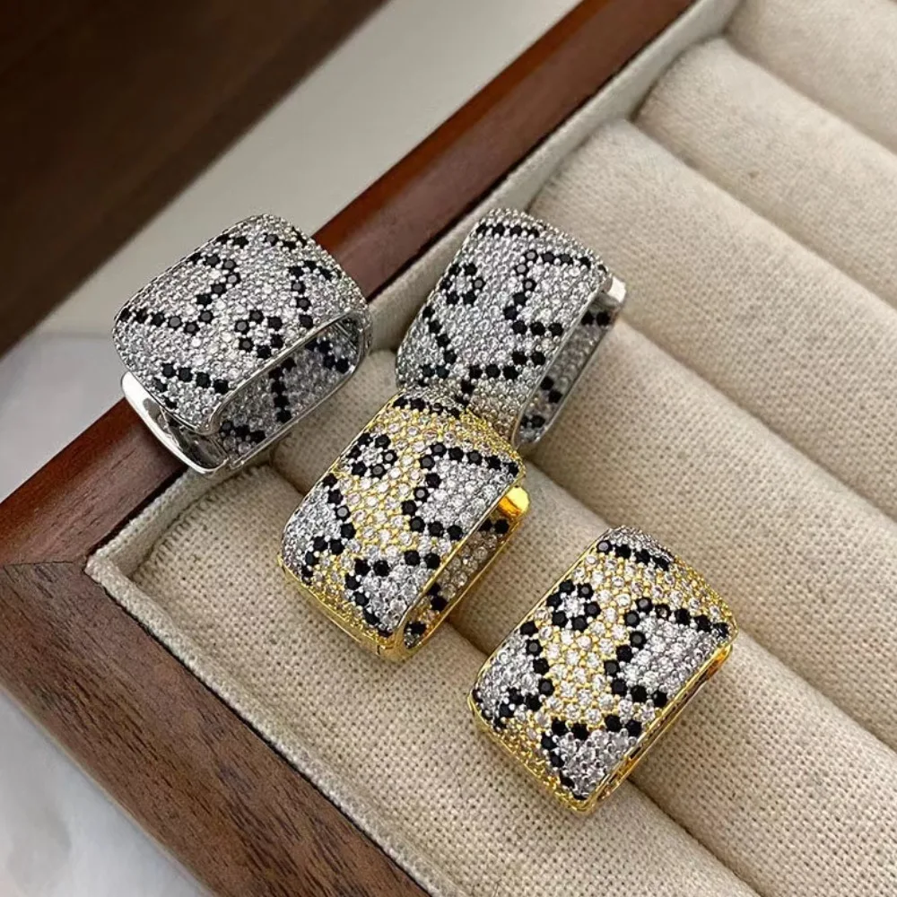 

Vintage leopard print earrings. Zircon on both sides, unique snake pattern design, exaggerated luxury women's wide earrings.