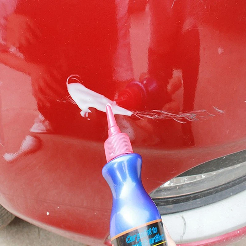 Small blue paint brush for car scratch repair solution for removing stains, scratch repair agent, and scratch free wax