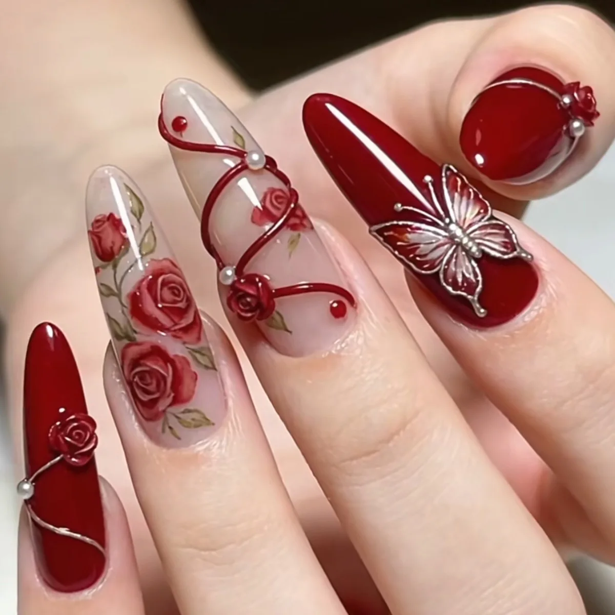 

24PCS Burgundy Press on Nails Almond Shape Fake Nails with 3D Silver Butterfly Rose Flower Pearl False Nails Nail Art for Women