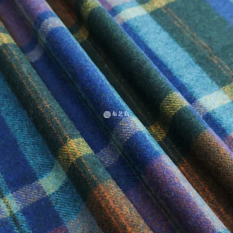 A blue-toned colored woolen fabric coat is used as the for clothing designers