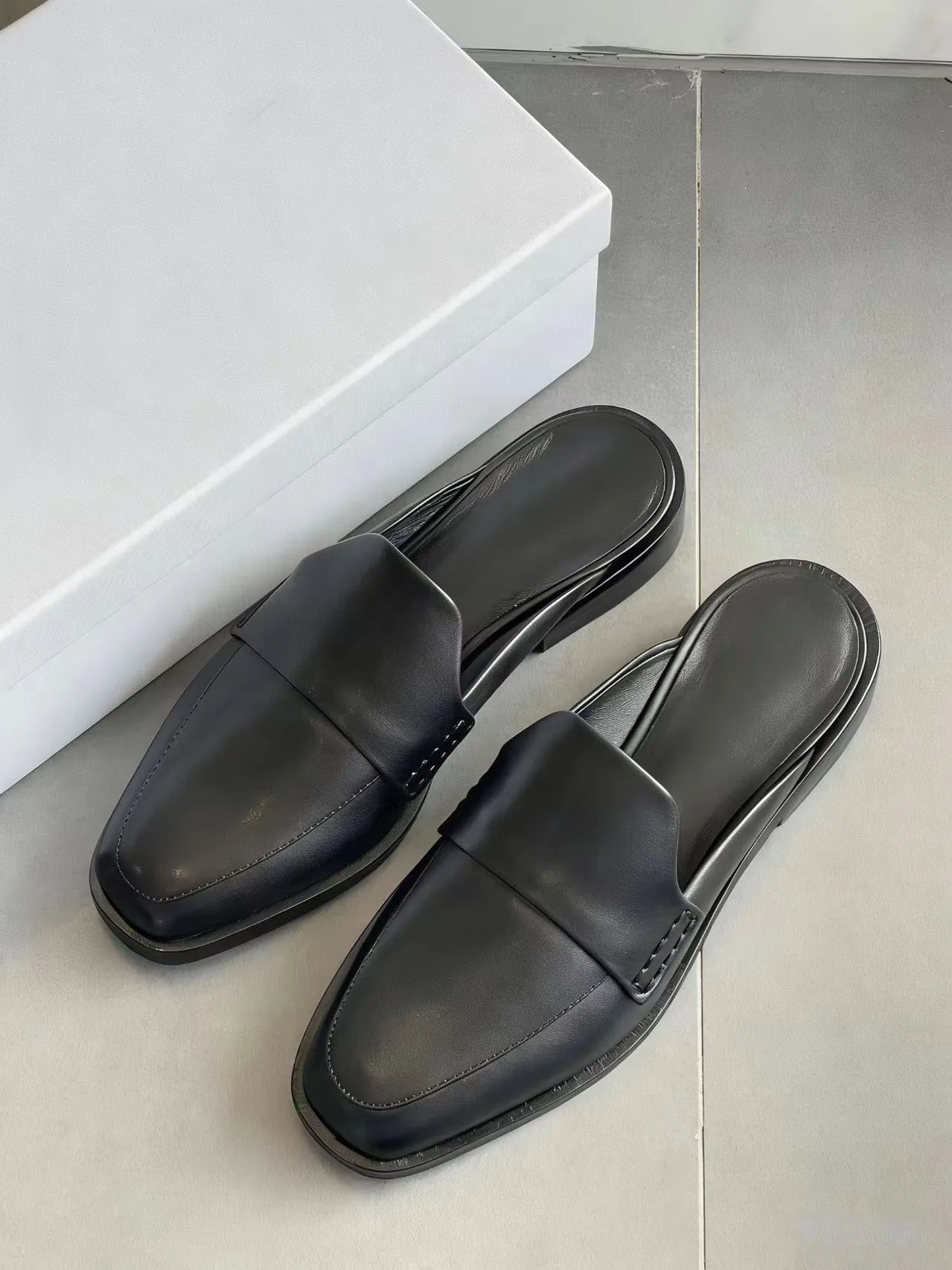 

Women Black Leather Slip-on Flat Mules