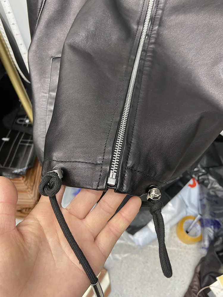 2025 ผู้หญิงฤดูใบไม้ผลิสายรัดสีดําหนังแกะแท้เสื้อแจ็คเก็ตฤดูใบไม้ร่วงหลวมจริงหนัง Overcoat