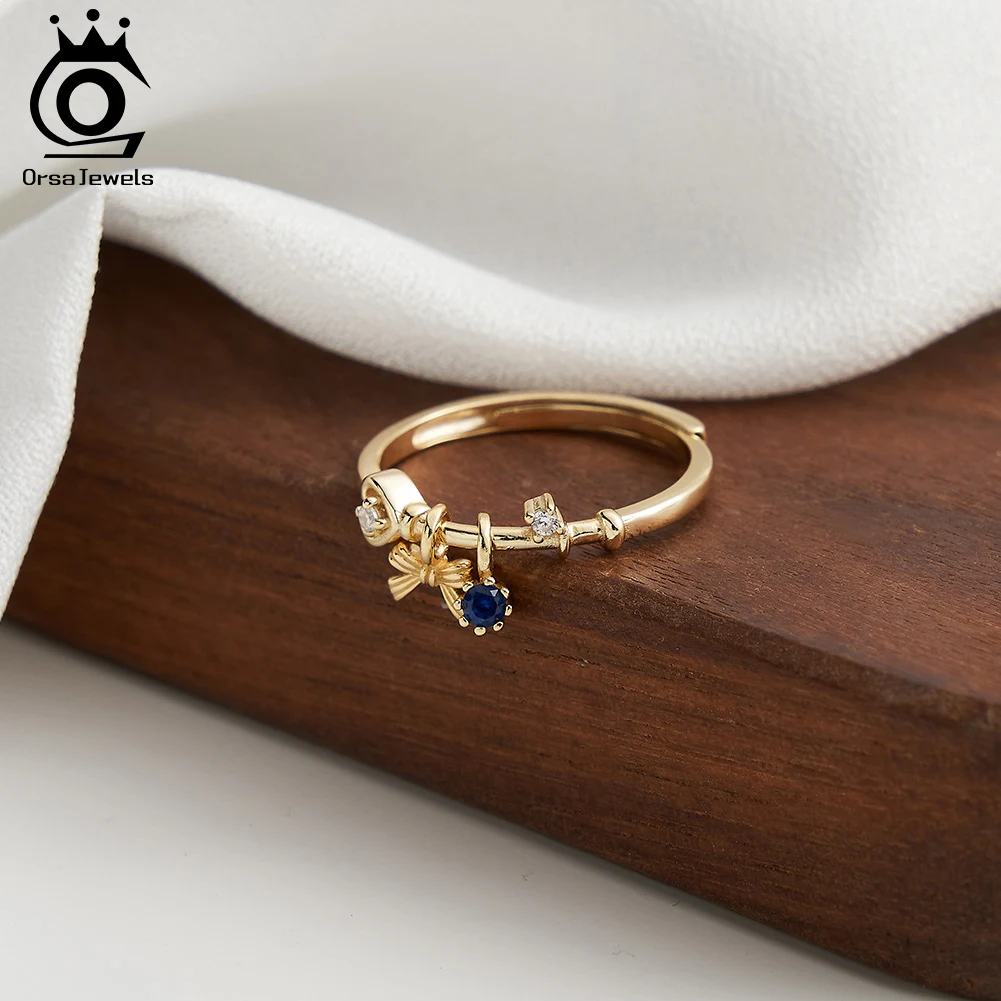 ORSA JEWELS Anillo con colgante de lazo de circonia cúbica de Plata de Ley 925, colgante redondo azul de zafiro de oro de 14 quilates, anillo abierto con ajuste de punta, regalo SR336