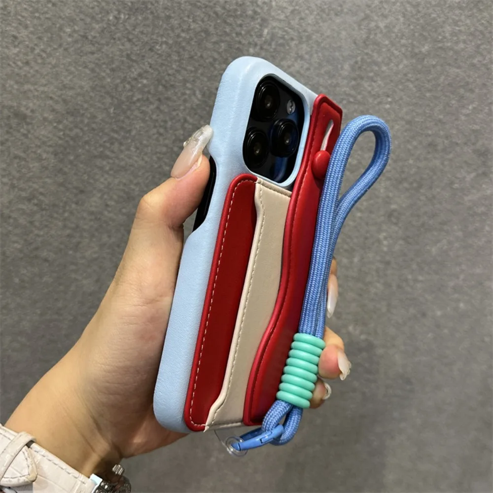 

Для iPhone 17 Pro Max Чехол на запястье с ремешком из овечьей кожи, держатель для карт, ручка с цветными блоками, совместимая с iPhone 16, 15, 14, 13, 12, 11