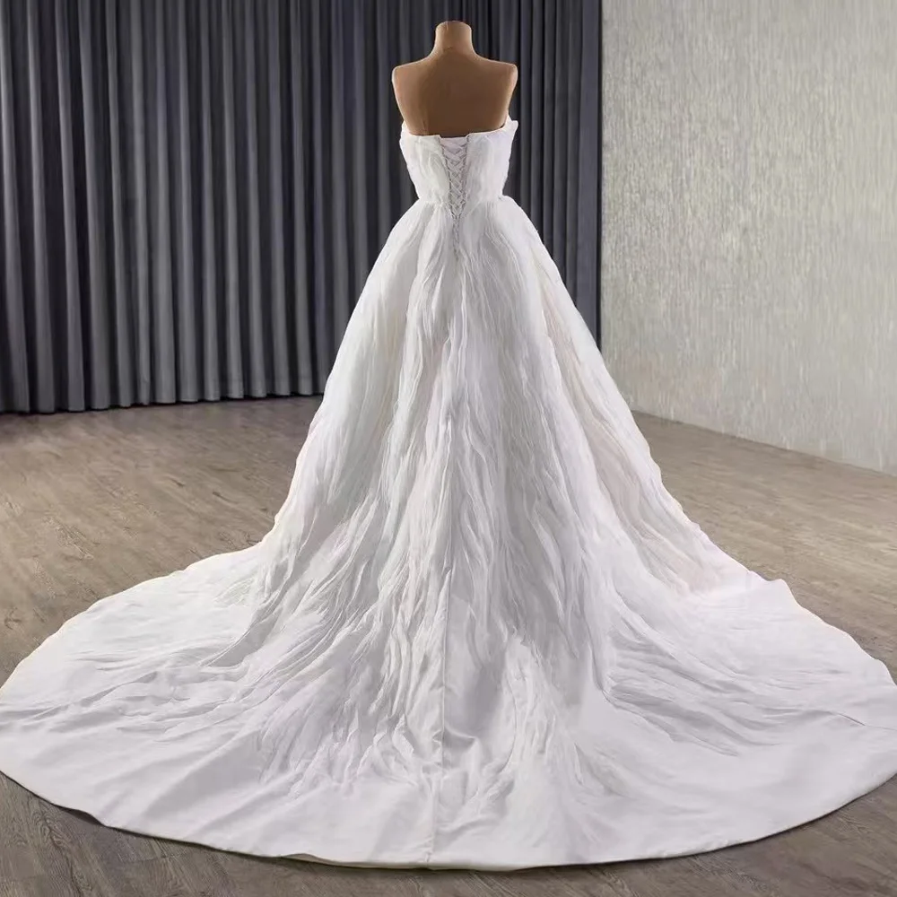 Abito da sposa sexy in pizzo senza spalline senza maniche con volant sul retro con lacci 2026 Robe De Mariage