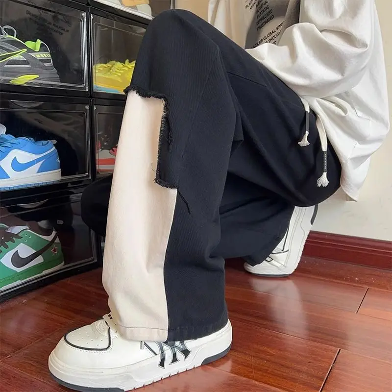 봄과 여름 남성 미국 패션 브랜드 하이 스트리트 인형 스플 라이스 대비 색상 루즈 스트레이트 캐주얼 바지