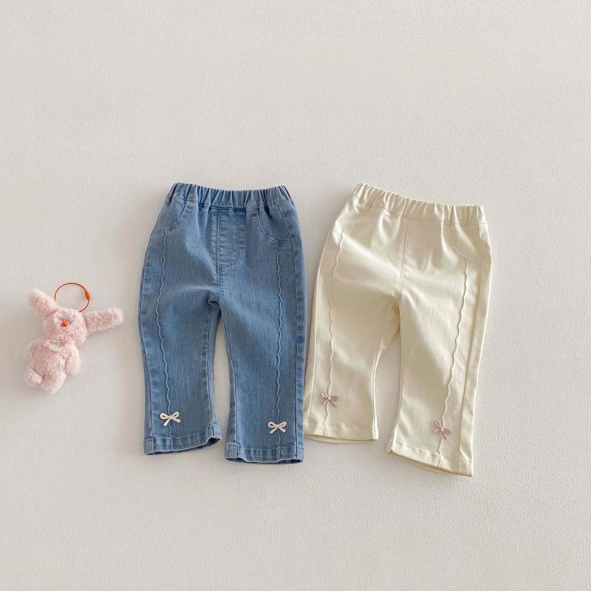 

2026 Spring New Girls Fashion Jeans Toddler Cute Bow Flared Trousers Solid Baby Girls Casual Pants Kids Clothes
