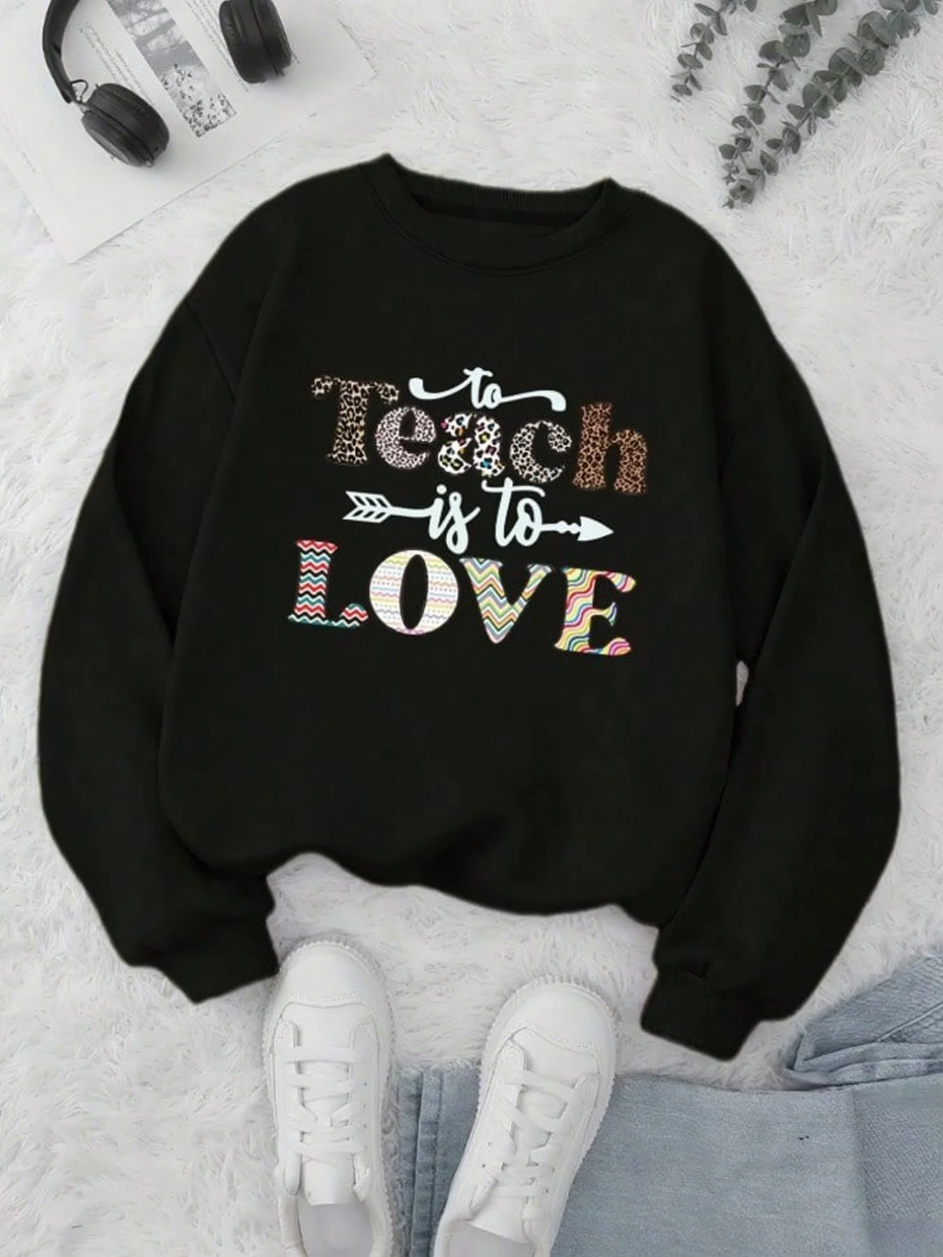 A global seasonal hoodie with a black base printed with the words 