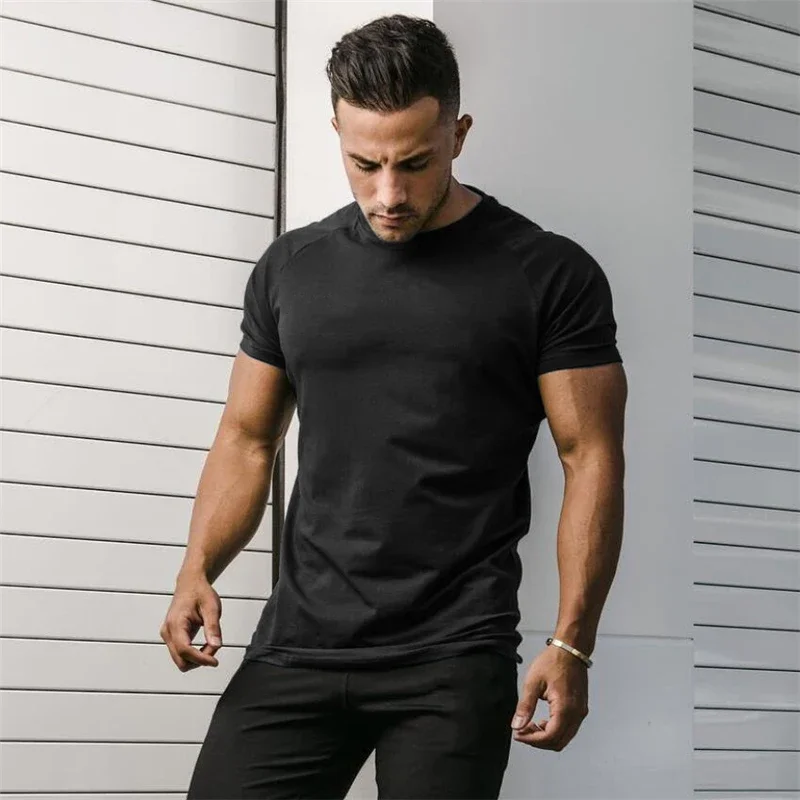 Zwykłe letnie bawełniane oddychające koszule z krótkim rękawem siłownia trening sportowy t-shirty do biegania mięśni męskie ubrania do kulturystyki i fitnessu