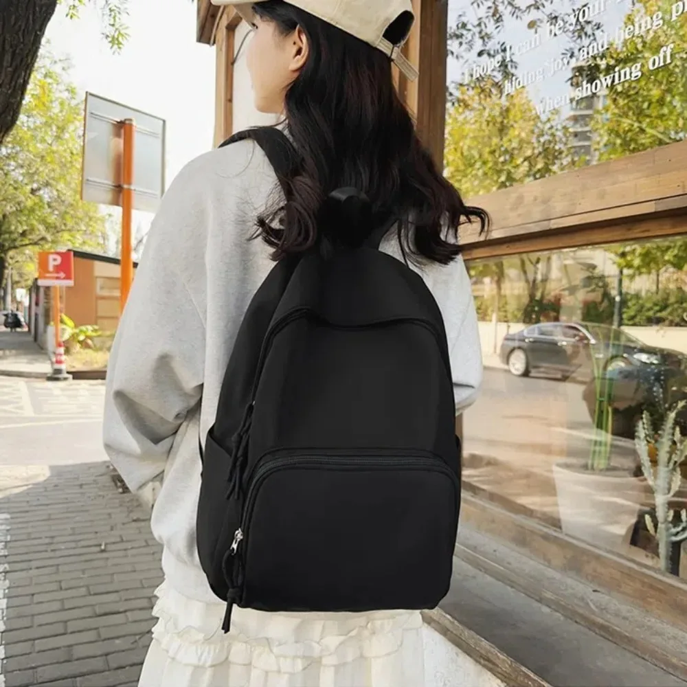 Mochila escolar de nailon para mujer, de gran capacidad morral, resistente al agua, para estudiantes, para exteriores, Color puro, novedad