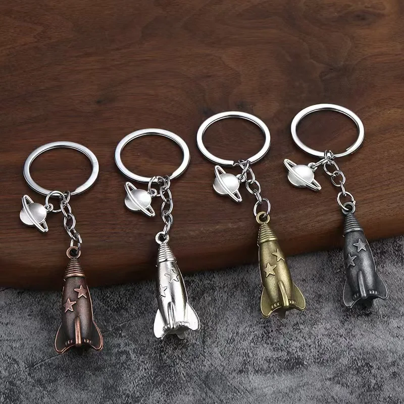 

100pcs/Lot Metal 3D Rocket Keychain Aero Model Pendant Plane Air Fly Keyring Science Technology Key Chains