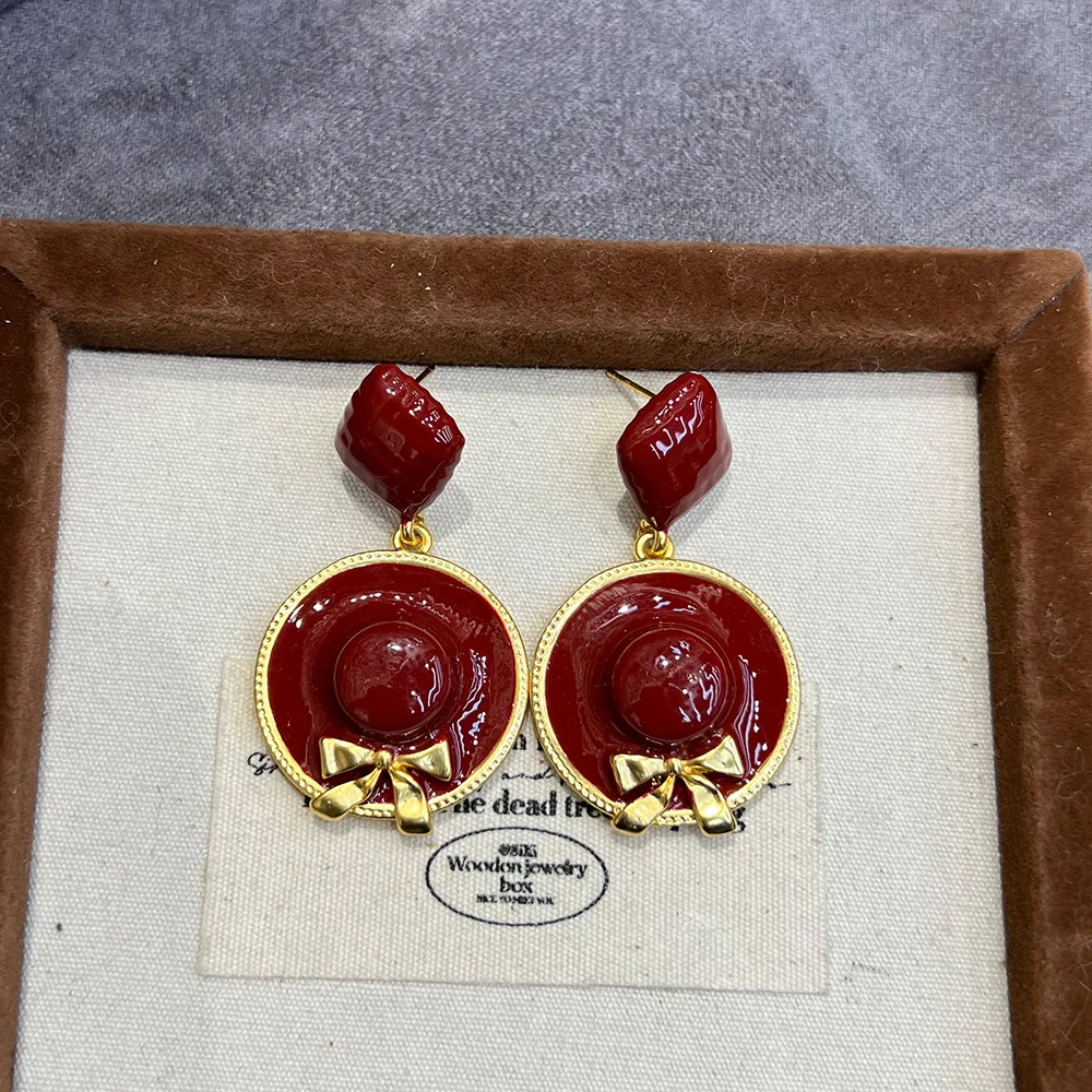 Star same creative earrings copper gold plated retro enamel oil dripping angola red bow straw hat earrings