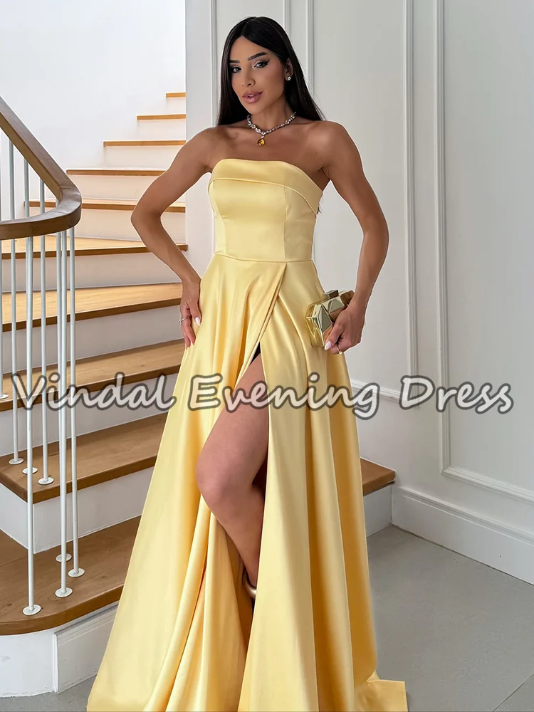 فساتين حفلة موسيقية أنيقة باللون الأصفر على شكل حرف A من Vindal بطول الأرض بدون أكمام من الساتان بدون حمالات وفتحة جانبية لحفلات الزفاف حسب الطلب