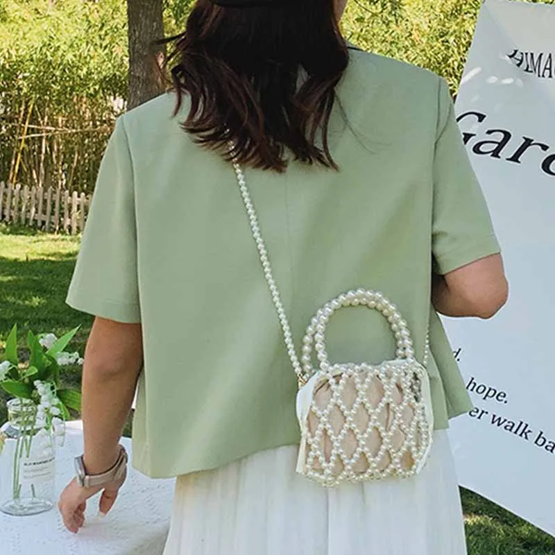 2022 New Niche All-match High-quality Beach Hollow Woven Pearl Acrylic Material Fashion Dinner Daily Crossbody Bags for Women