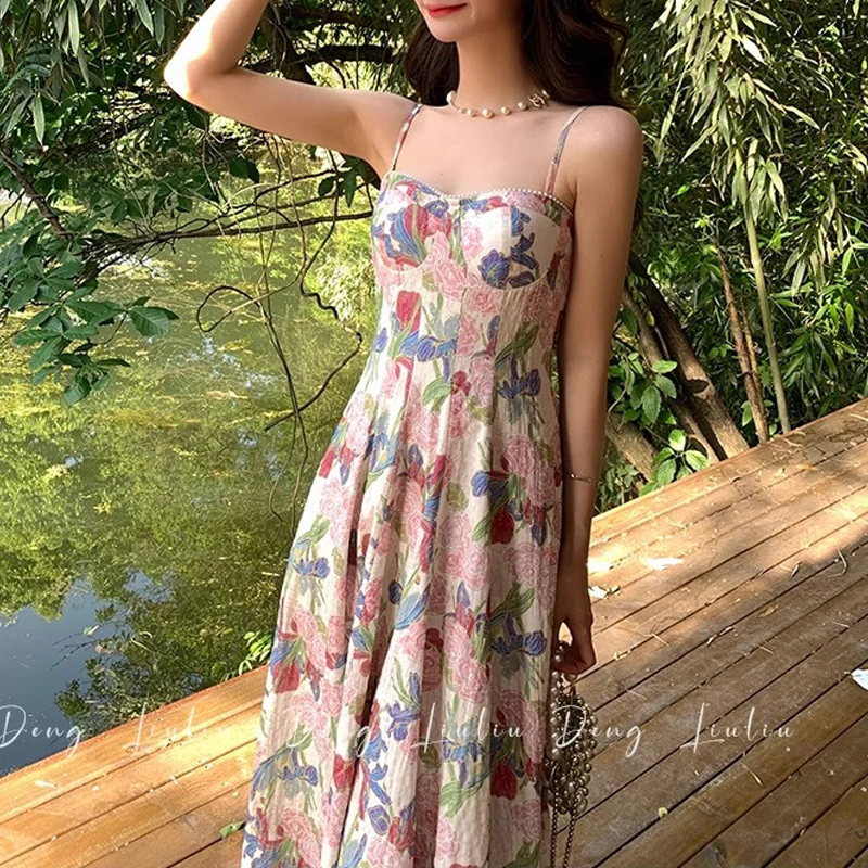 Seksowny pasek Spaghetti Backless eleganckie sukienki imprezowe dla kobiet 2024 lato w stylu Vintage kwiatowy Print bez rękawów wąska plaża Midi sukienka