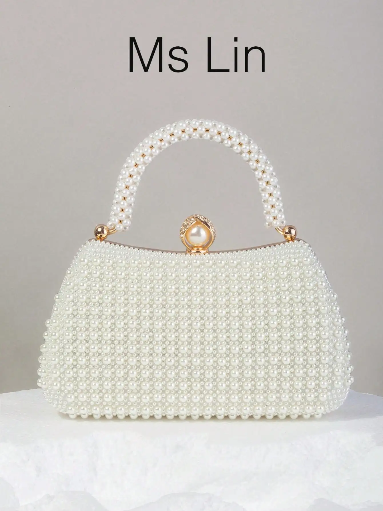 

Элегантный клатч с жемчужной отделкой и верхней ручкой для торжественных мероприятий