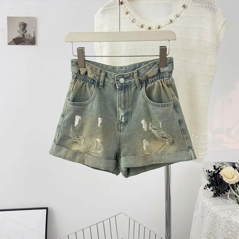 Retro casual distressed denim shorts with holes women's summer design sense high waist slimming A-line wide leg hot pants