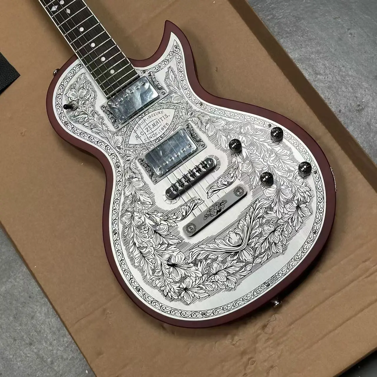 

Hand Carved Duralumin Top Electric Guitar Floral Vine Scrollwork Red Brown Binding HH Humbuckers Fixed Bridge Rosewood Special I