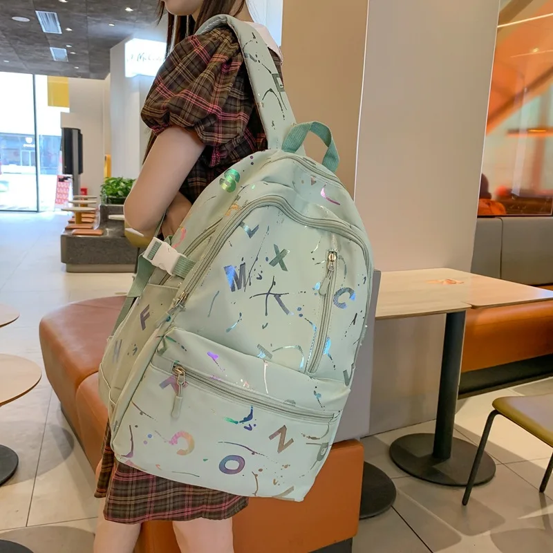 Sacs à dos d'école étanches pour jeunes filles, lettre imprimée, grande capacité, sac à dos de voyage multifonctionnel, sac de livre tendance, nouveau, 2024