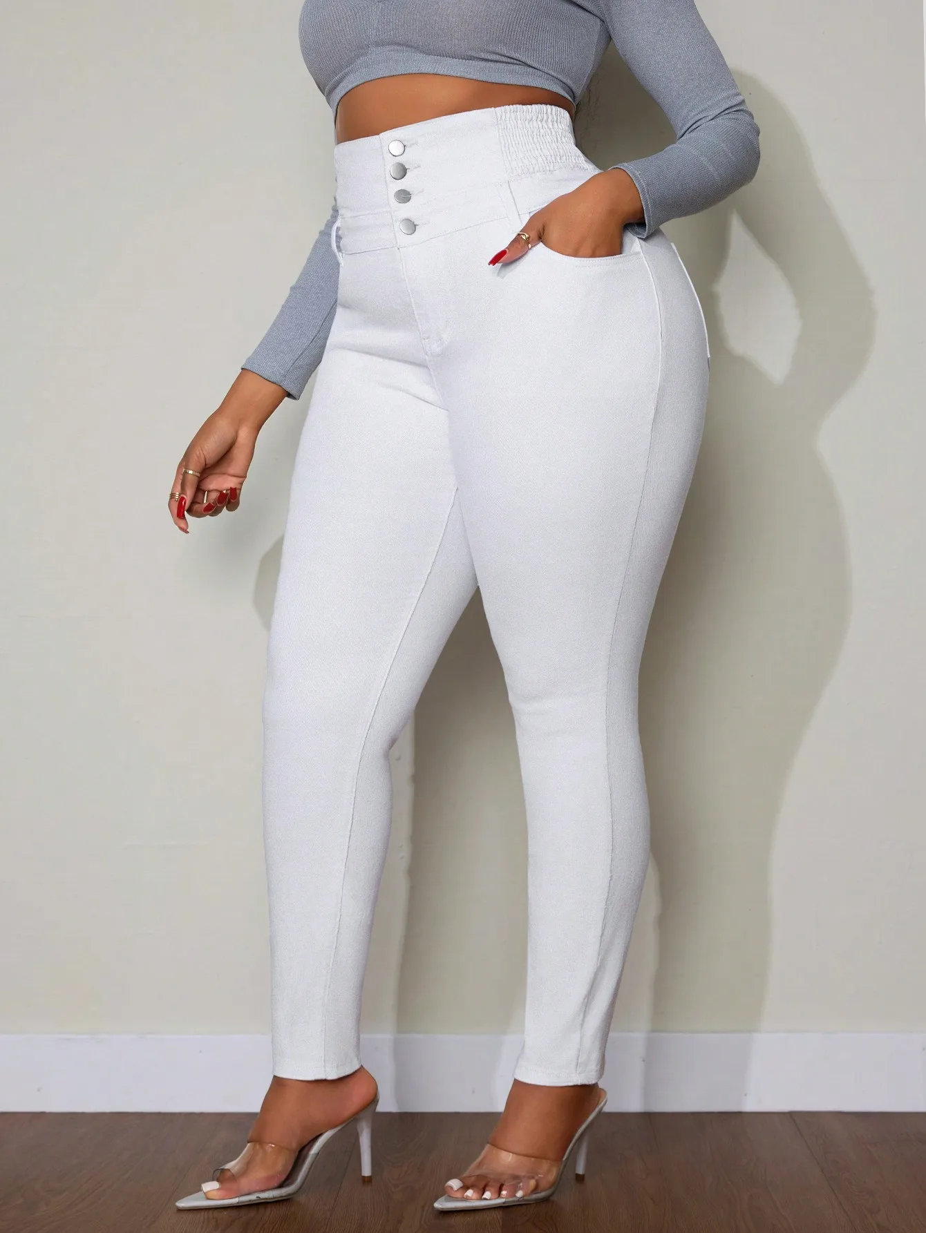 

Женские джинсы с высокой талией, застежкой на пуговицах и карманами, для повседневной носки.