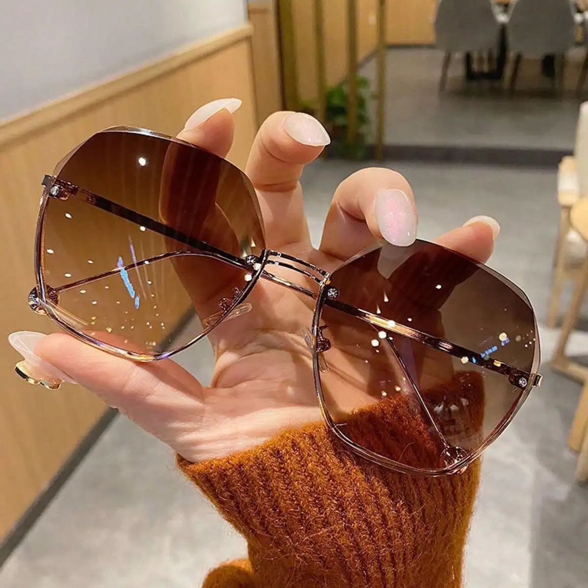 

A pair of sunglasses new rimless trimmed sunglasses metal sunglasses ladies fashion glasses