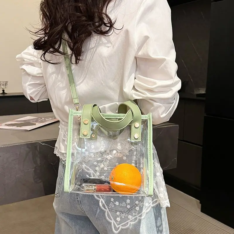 กระเป๋าเยลลี่ใส PVC ยอดนิยมสำหรับฤดูร้อน ดีไซน์ต่อผ้ากันน้ำ กระเป๋าถือผู้หญิงสุดเก๋