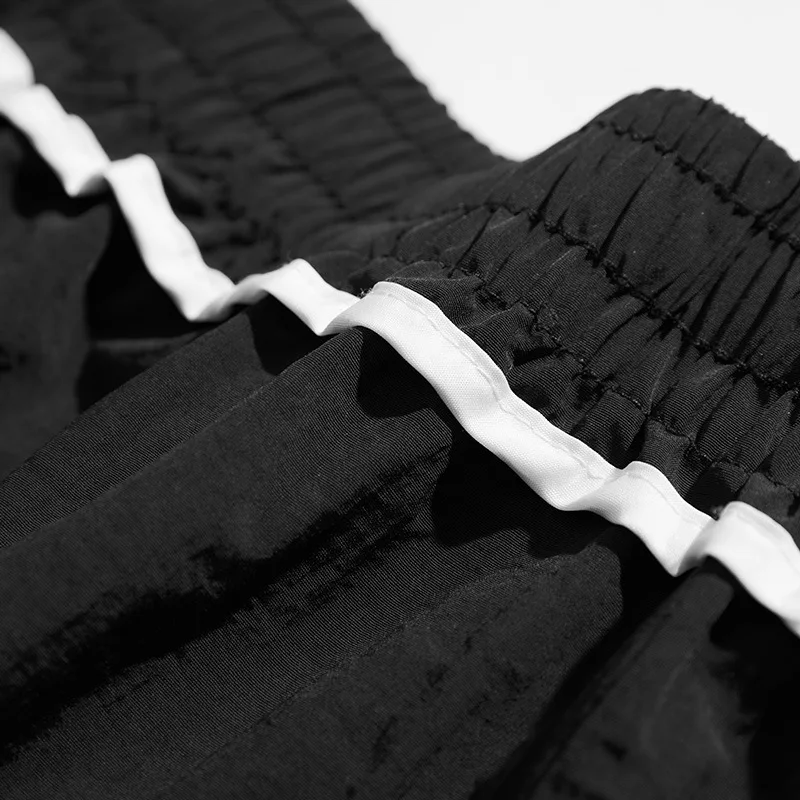 صيف جديد الرجال العلامة التجارية العصرية ملابس العمل السراويل الكورية فضفاضة كبيرة الحجم سراويل تقليدية تنفس التجفيف السريع أزياء الشارع