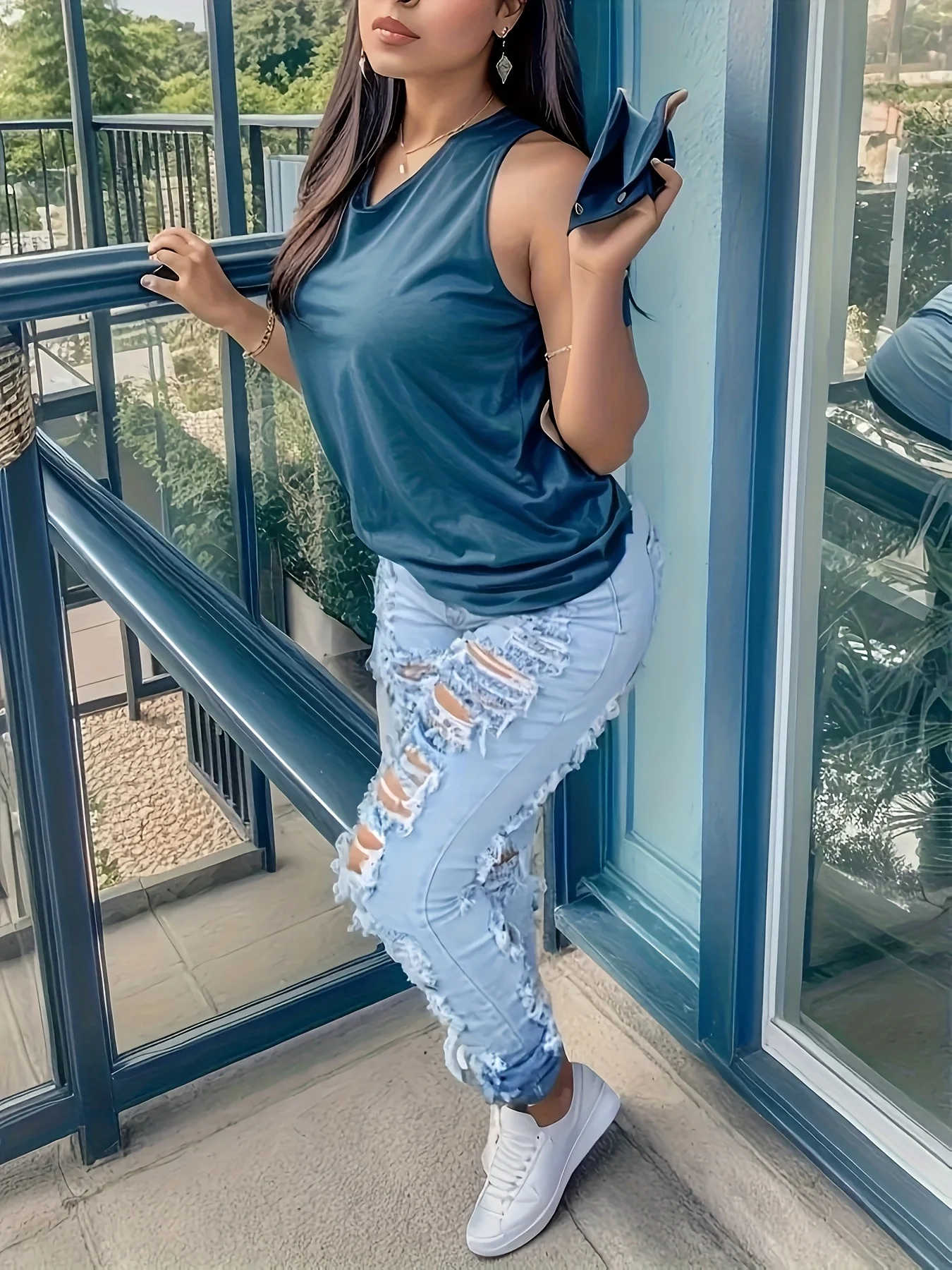 

Women's spring and summer high waisted light blue denim, with heavy frayed edges and many holes, fashionable denim pants