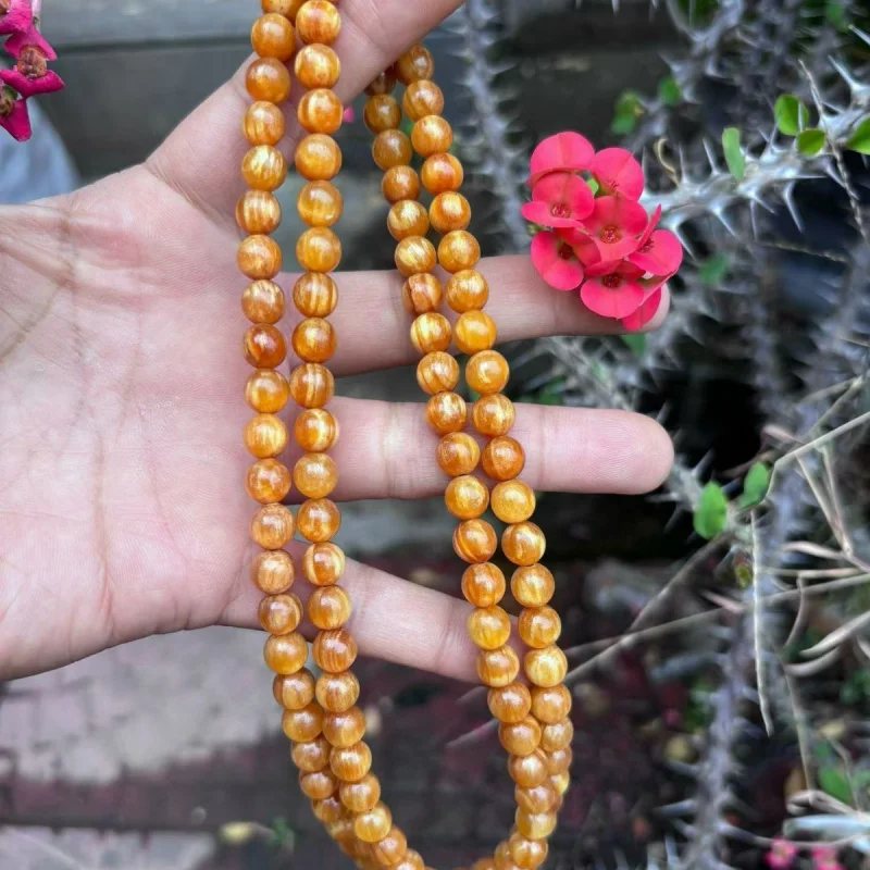 

Браслет из северо-восточной сосновой древесины, полностью прозрачный, богатый янтарем, 108 бусин, многослойный, для мужчин и женщин.