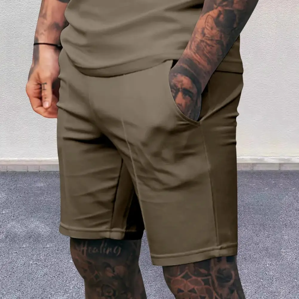 Celana Pendek Pria Regular Fit Celana Pendek Kaki Lebar Pinggang Elastis Menengah Pria dengan Saku Celana Panjang Kasual Warna Solid untuk Pakaian Sehari-hari