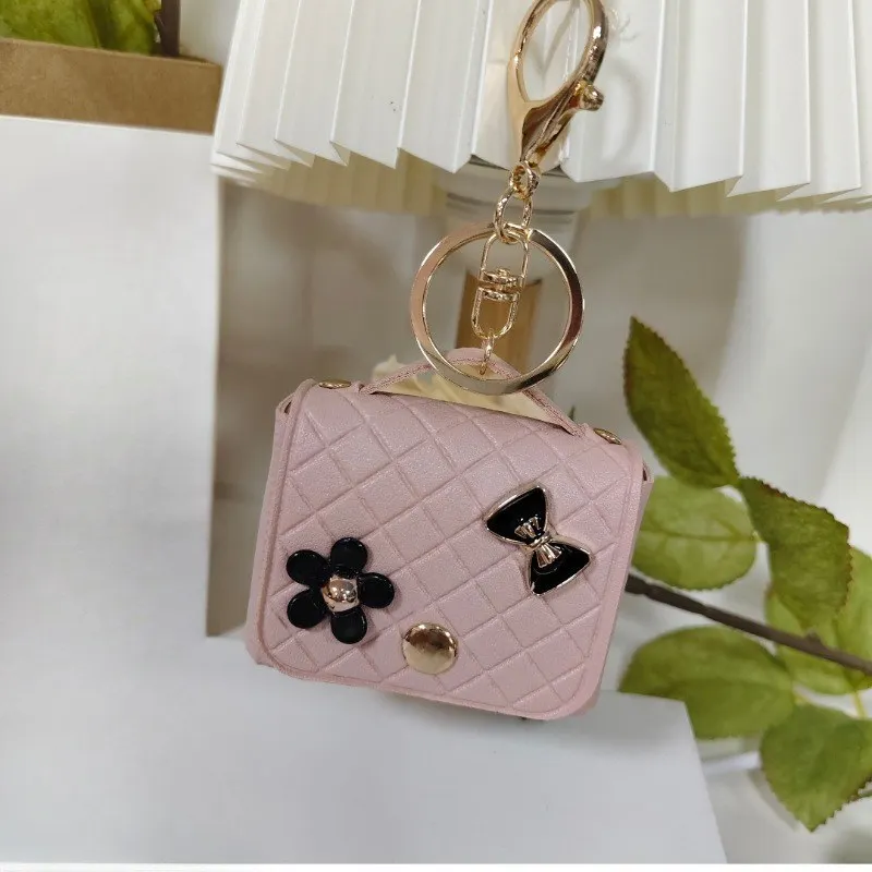 

Fashion niche Lingge small fragrant style mini headphone bag pendant doll accessories keychain pendant