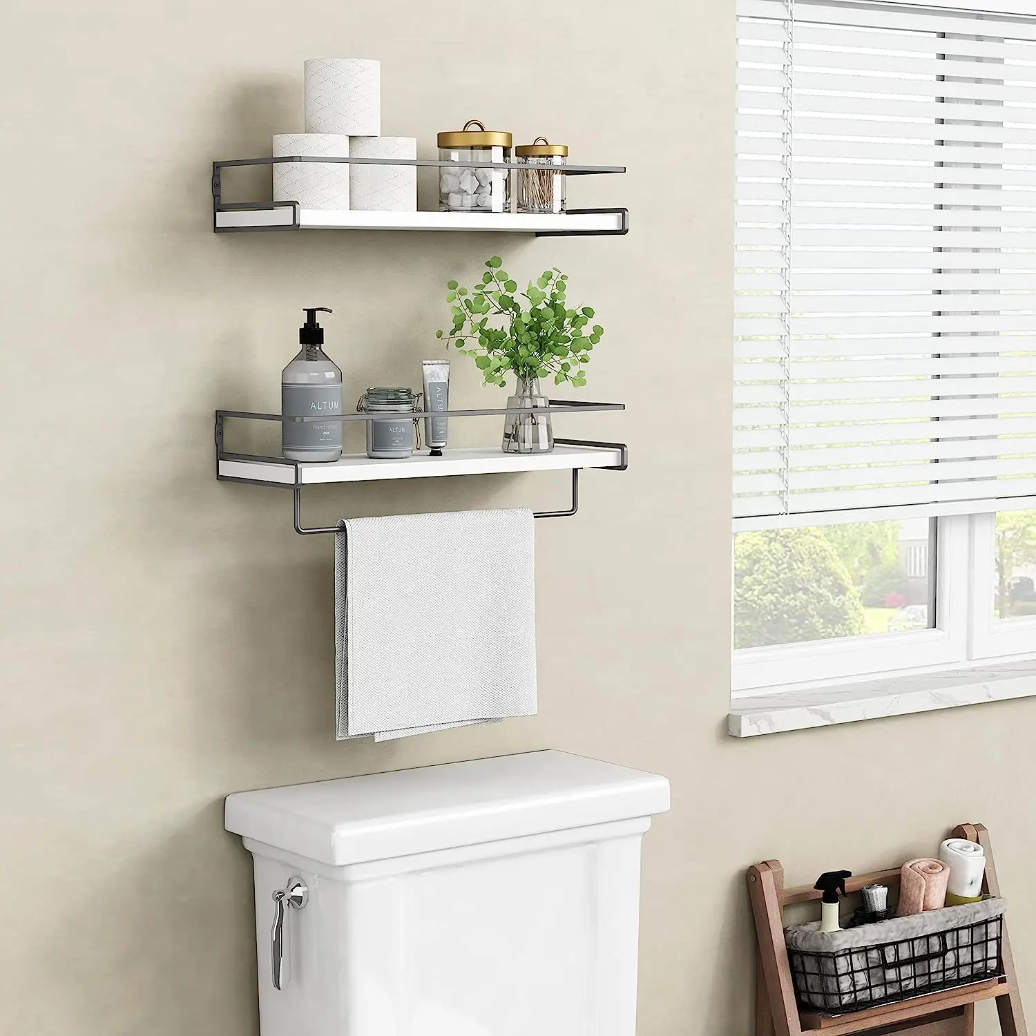 A newly designed set of 2 white floating shelves for the bathroom organizer on the toilet