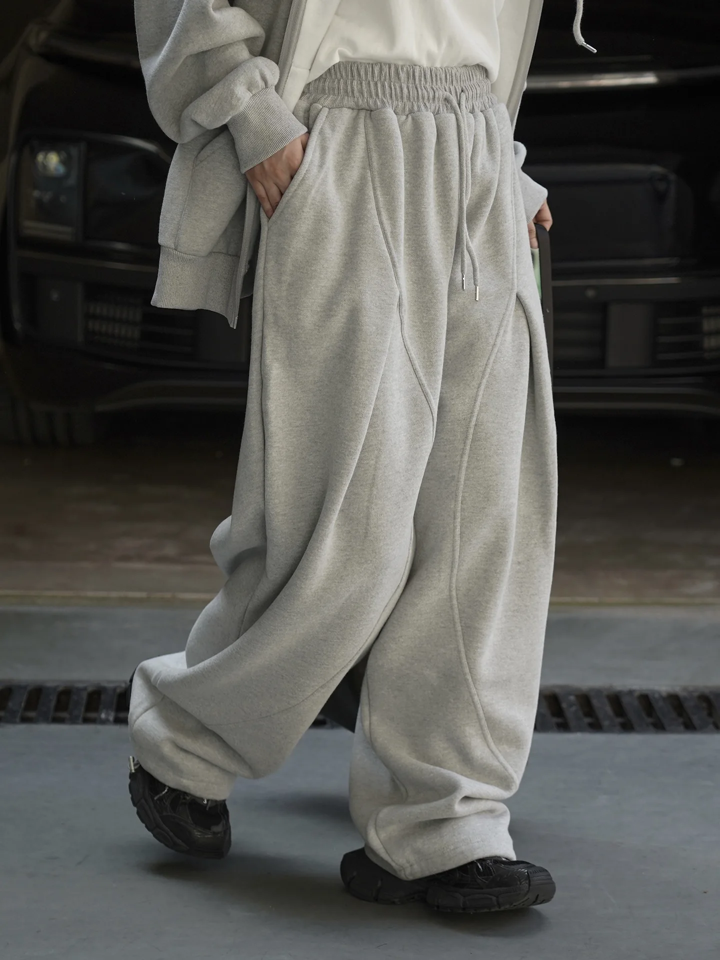 겨울 신상 한국 버전 심플한 신축성 있는 드로스트링 대칭 아치형 스플릿 캐주얼 팬츠 여성용 루즈 팬츠