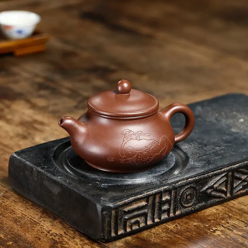 sold at a loss real yixing zisha tea pot marked 7 infuser holes purple clay pot