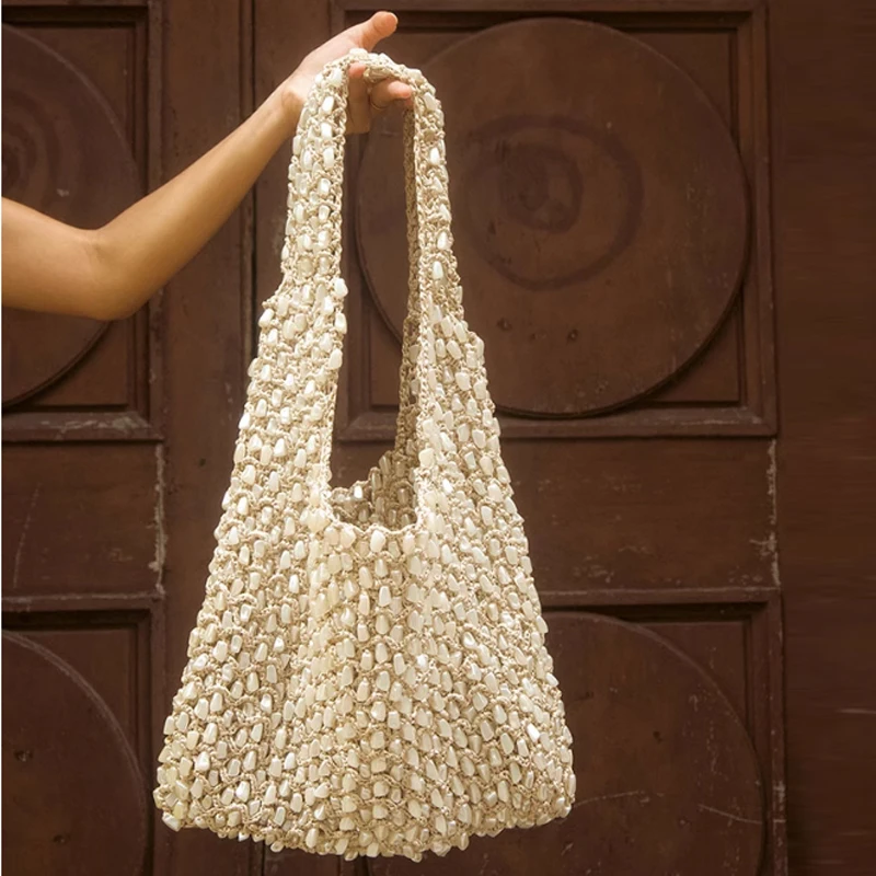 

New Hand Woven Shoulder Bag With Fashionable Design And Beaded Handbag Versatile and Casual Travel Hollow Woven Bag