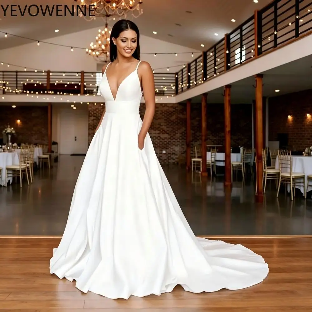 A Line Spaghetti Straps Wedding Dress for Bride Long Train Satin Deep V Neck Bridal Gown with Pockets