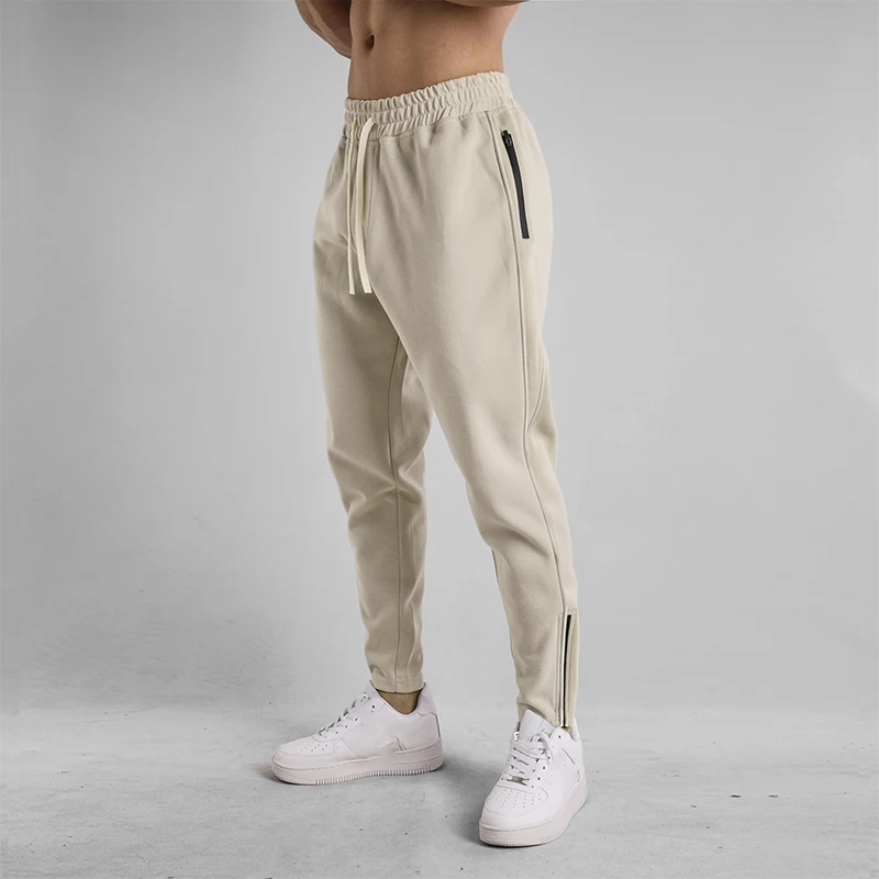 

Модные укороченные спортивные штаны на молнии с боковым разрезом, мужские новые шаровары с эластичной резинкой на талии, осенне-зимние тонкие брюки для фитнеса