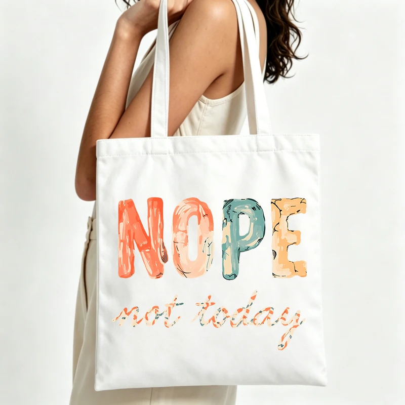 slogan-style canvas tote bag with colorful letter print, perfect for casual daily use and shopping outings