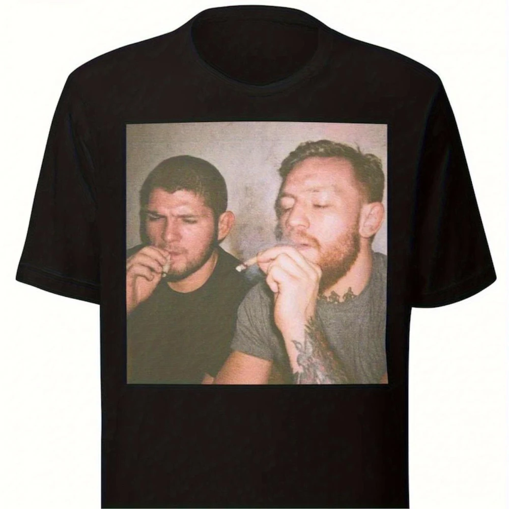 New T-Shirt Showcasing A Funny Design of Khabib and Conor It Comes in Black with A Crew Neck Short Sleeves This Playful Design
