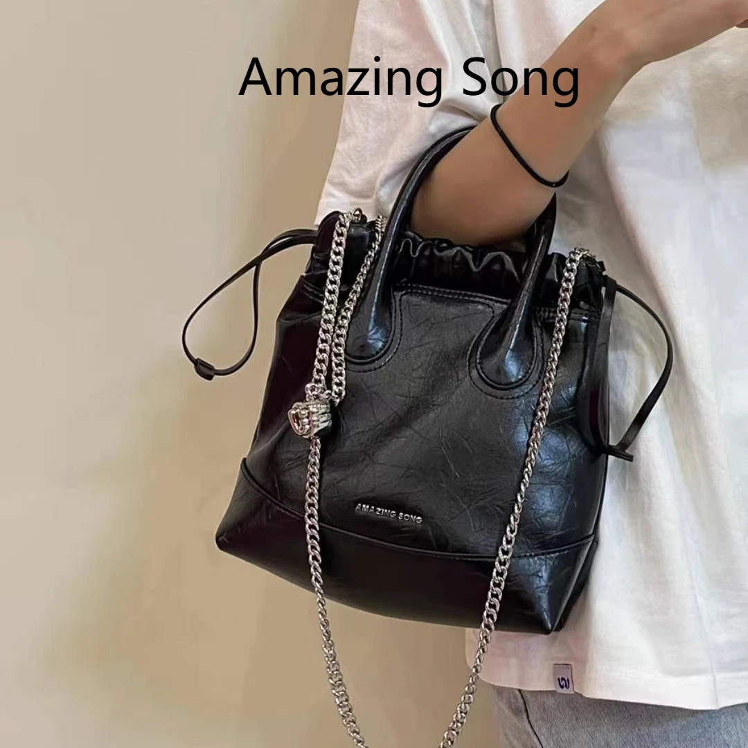 

Многосторонняя кожаная сумка Amazing Song — большой кошелек-бродяга с цепочкой, трансформируемым рюкзаком и через плечо