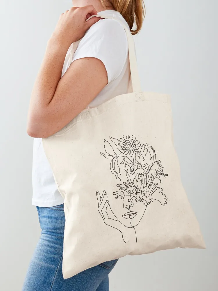 Woman with flowers by line art drawing. Portrait minimalistic style. Botanical print. Flower head. Tote Bag Shopping bags