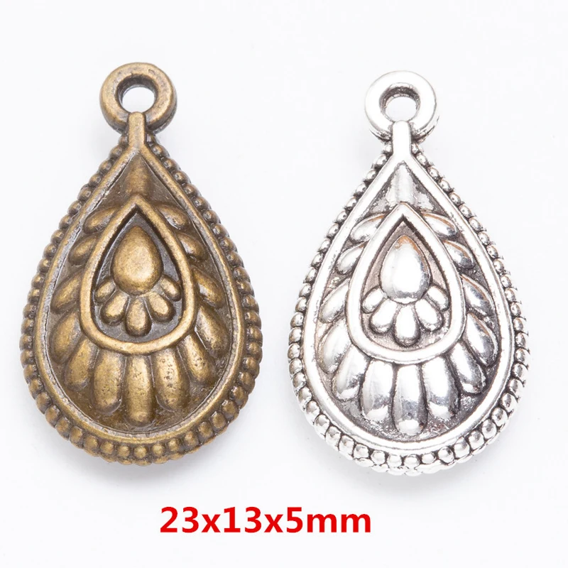 50pcs 23X13MM Fashionable Boutique Girl Retro Silver Decorative Peacock Feather Water Droplet Charm Pendant. Simple And Smooth L