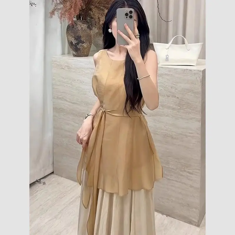 Nuevo conjunto pequeño y fragante de lujo de dos piezas para mujer, moda de verano, blusa sin mangas con cordones, Top + falda larga acampanada, traje elegante