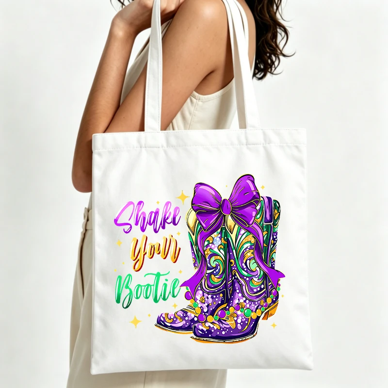 western-style boot graphic canvas tote bag with bow and typography print, perfect for Mardi Gras celebrations and casual outings