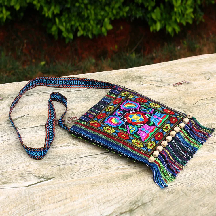 2023 new Yunnan ethnic style embroidery bag striped cloth embroidery single shoulder oblique span tassel camellia bag